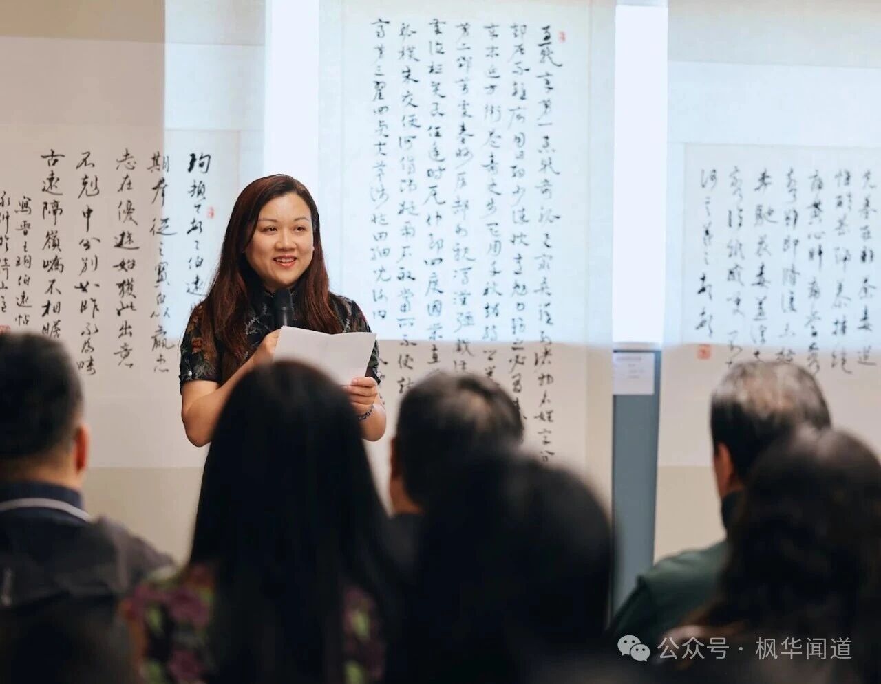 Ms. Ling Xi reading the congratulatory letter and poem