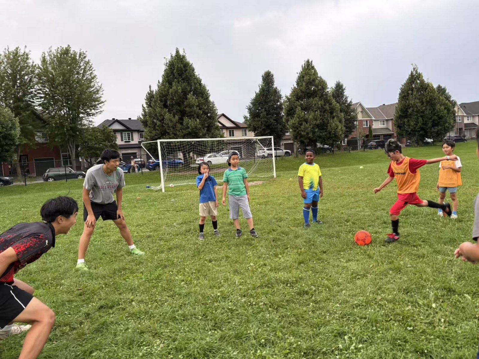 Children attending Day 12 of summer soccer training on August 16, 2026