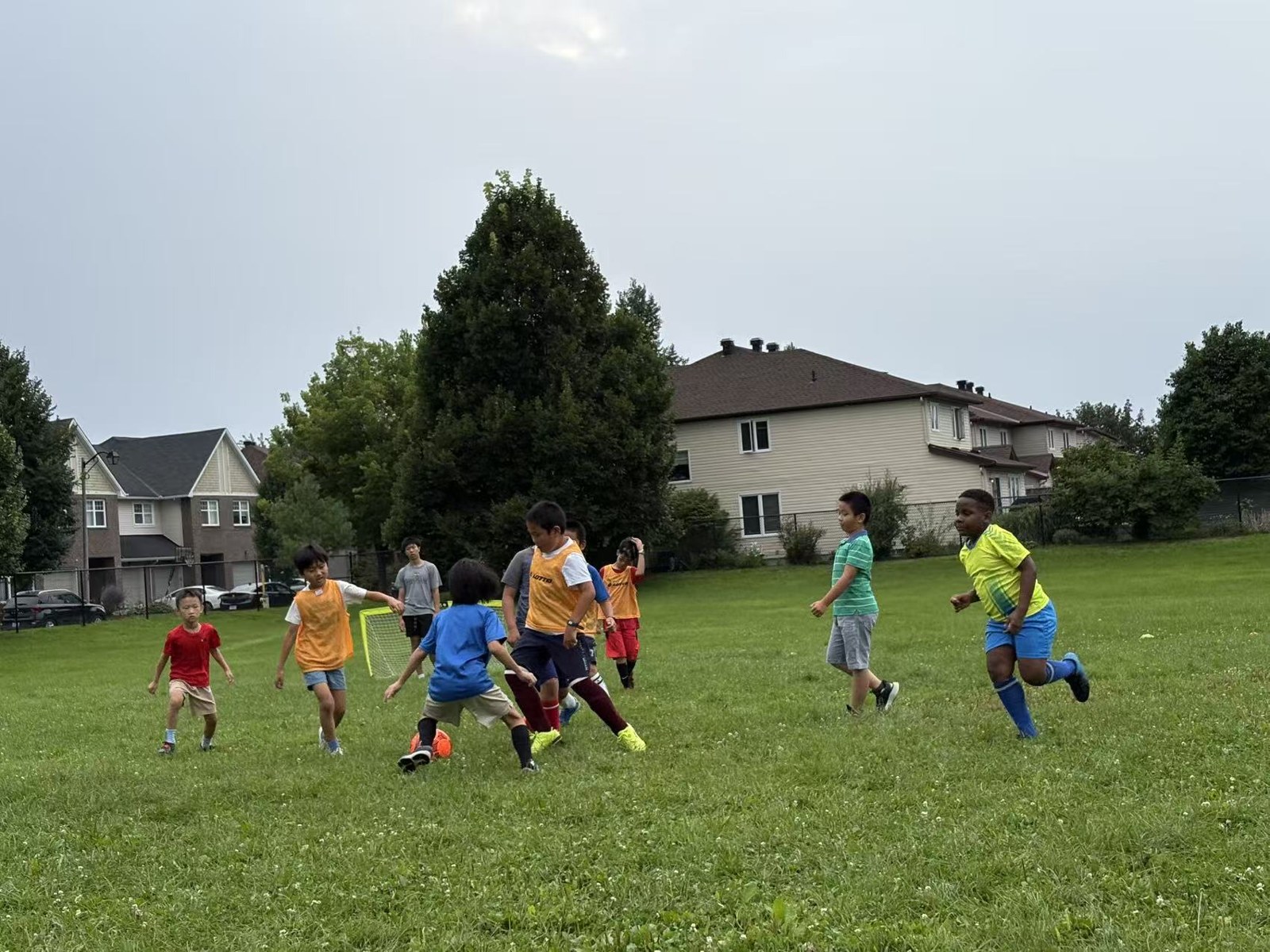 Children participating in two-on-two soccer scrimmage training