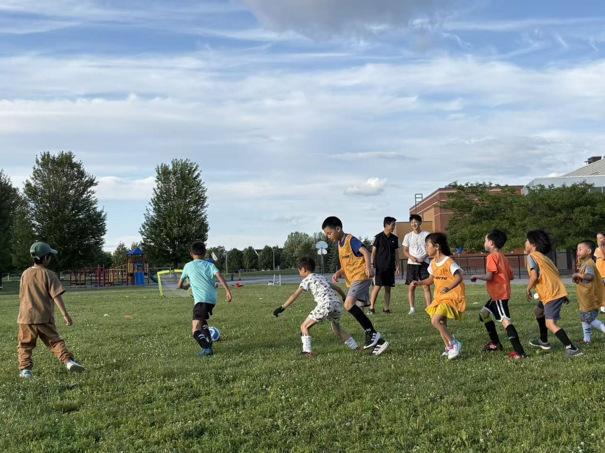 Children participating in two-on-two soccer scrimmages