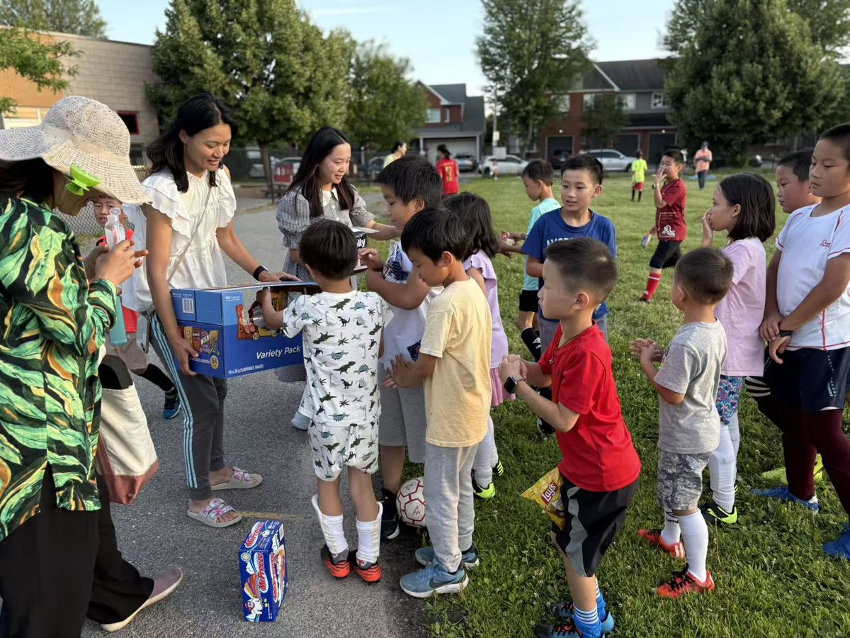 Children receiving ice cream, chips, and Freezies after soccer